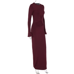 Close-up of side pleats and ruched waist detail on a wine red bodycon maxi dress