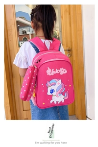 Detailed view of pink unicorn kids backpack with matching star pattern round pouch accessory