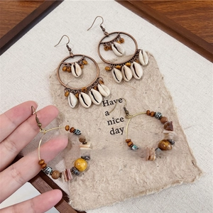 Bohemian seashell tassel earrings with antique bronze hoops and colorful ethnic beads