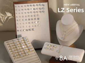 Macro detail of various 8A cubic zirconia stone cuts in gold settings on luxury stands
