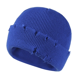 Distressed royal blue knit beanie with vintage ripped details for autumn and winter outdoor warmth