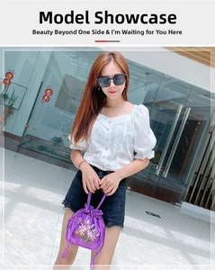 Detail of purple satin drawstring handbag with colorful floral embroidery for women