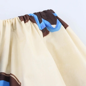 Detail of elastic waist on floral A-line skirt with beige blue and brown pattern