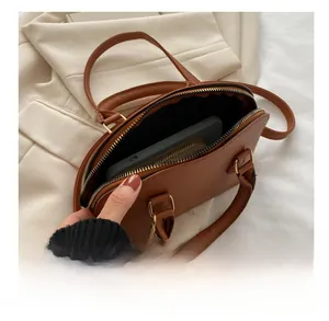 Top view of brown crocodile pattern shell bag showing interior capacity and storage