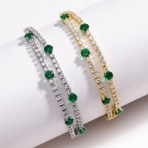 Dual layer gold and silver tennis bracelet with 4mm white zircons and green center stones