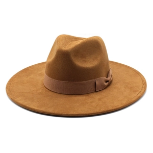 Classic camel brown wide brim fedora hat with satin ribbon and bow on white background