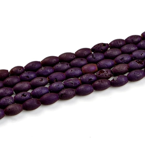 Macro shot of 8x12mm purple geode agate beads with druzy texture for jewelry making