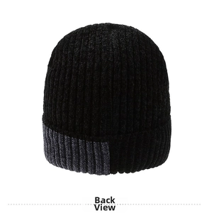 Detail view of the black knit beanie with gray contrast patch on the ribbed cuff