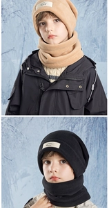Close-up of children's fleece beanie and neck warmer set with mountains logo patch