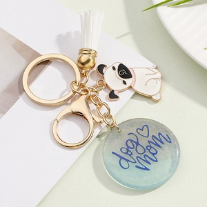Detail of colorful tassel keychain with Pug pendant and circular resin dog mom charm