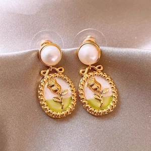French retro gold earrings with rose enamel pattern and pearl bow details