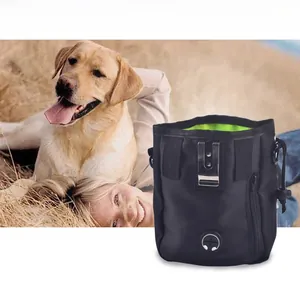 Detail of dog training pouch with neon green lining, metal belt clip, and drawstring closure