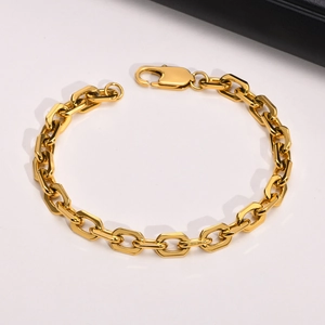Detailed macro view of 18K gold-plated stainless steel chain links with lobster clasp