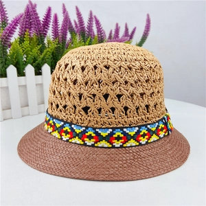Women's hollow crochet straw sun hat with ethnic style ribbon and bicolor design