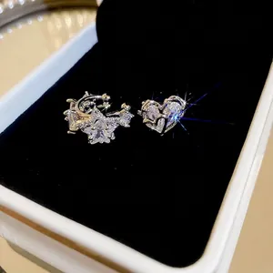 Asymmetric zircon star and heart ear cuffs in silver finish with sparkly pave detailing