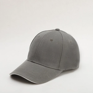 Detail view of a classic grey six-panel twill cotton baseball cap with curved brim