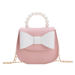 Pink princess crossbody bag with pearl handle and white bow accent for girls