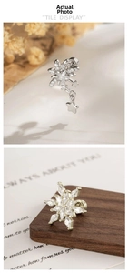 Detailed close-up of coffee gold snowflake stud earrings with white crystal inlay