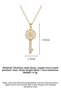 Detailed view of gold starburst key pendant with sparkling pavé micro-inlay crystals