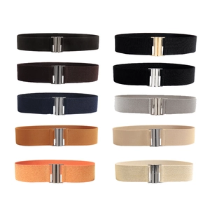 Flat lay display of women's elastic wide belts in ten vibrant colors with metal buckles