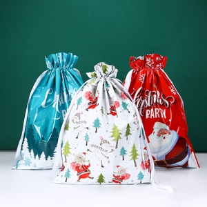 Three Christmas drawstring gift bags featuring Santa, Snowman, and Tree festive patterns