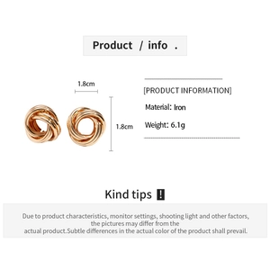 Detailed view of gold twisted geometric stud earrings with 1.8cm diameter and iron material
