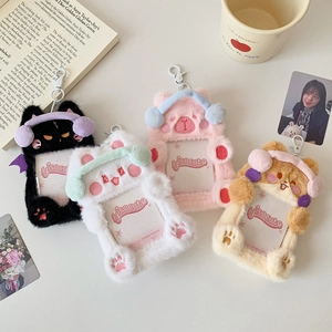 Flat lay of colorful plush photo holders with earphone-wearing animal designs and cute props