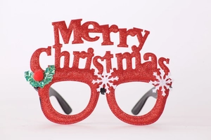 Detail of red glitter Christmas glasses featuring Merry Christmas text and snowflake accents