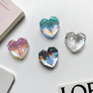 Macro view of heart-shaped laser cut acrylic phone sockets in iridescent colorful tones