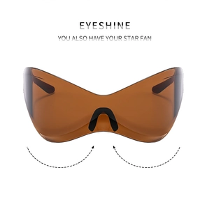 Macro detail of futuristic Y2K sports sunglasses with dark brown lens and sleek frame