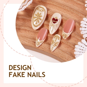Faux ongles amande français avec motifs floraux 3D dorés et accents de cœur