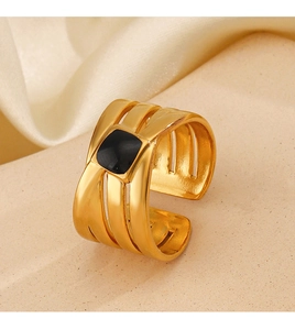 Detailed macro view of 18K gold plated wide band ring with square black enamel inlay