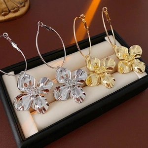 Chic gold and silver oversized flower hoop earrings with sparkling crystal centers