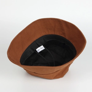Detail view of cotton bucket hat interior with windproof rope and adjustable sweatband