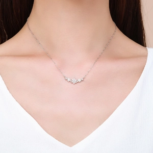 Elegant S925 sterling silver flower necklace with sparkling zircon pavé on model