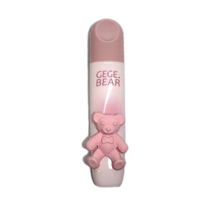 Matte velvet lip glaze with a cute pink bear decoration and clear bottle tube