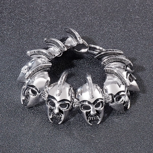 Detailed view of punk style spartan warrior helmet links in vintage silver steel