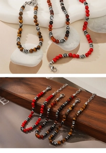 Detail of natural stone beads with tiger eye and turquoise on a premium wood background