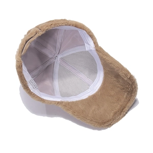 Detail view of the khaki plush baseball cap with cotton lining and internal mesh structure