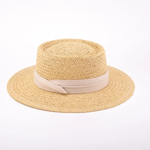 Handwoven beige boater hat with wide brim and elegant ribbon band for sun protection