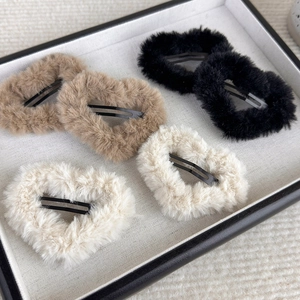 Set of six fluffy plush heart-shaped hair clips in khaki, black, and beige colors
