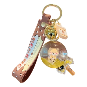Adorable bubble tea bear keychain featuring a liquid floating charm and brown wrist strap