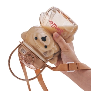 Bear shaped water bottle with straw, smile print and adjustable brown shoulder strap