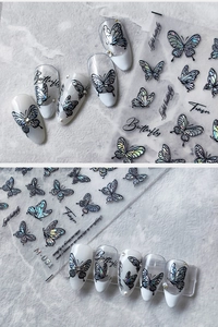 Macro detail of holographic butterfly nail stickers and 3D metallic decals on nails