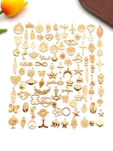 Detailed assortment of KC gold alloy pendants including tree of life and animal charms