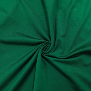Macro detail of dark green pleated fabric showing fine texture and sleek drapery