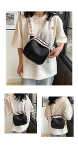 Detailed views of black nylon shell bag with vibrant ethnic style wide shoulder strap