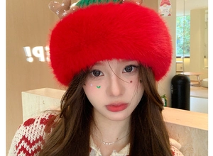 Detailed view of red Christmas reindeer antler plush hat and matching knit scarf set