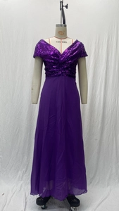 Detailed view of the deep V-neck sequined bodice and pleated waist on this purple evening gown