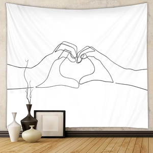 Detailed view of minimalist black and white line art tapestry with heart hand gesture